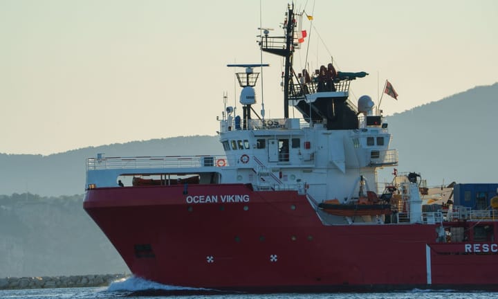 Assailants board minuscule vessel amidst salvage operations close to Libyan coastline.