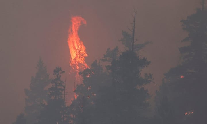 Forecast of further extreme temperatures prompts evacuation due to escalating Canada wildfire crisis.