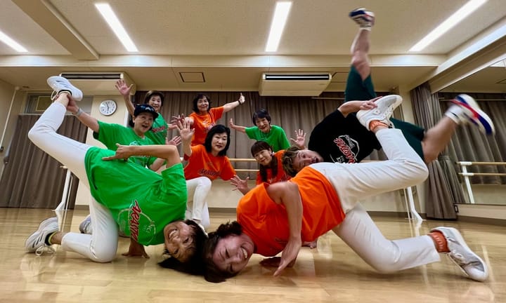 Elderly Japanese individuals engage in tailor-made breakdance routines featuring music designed for mature demographics