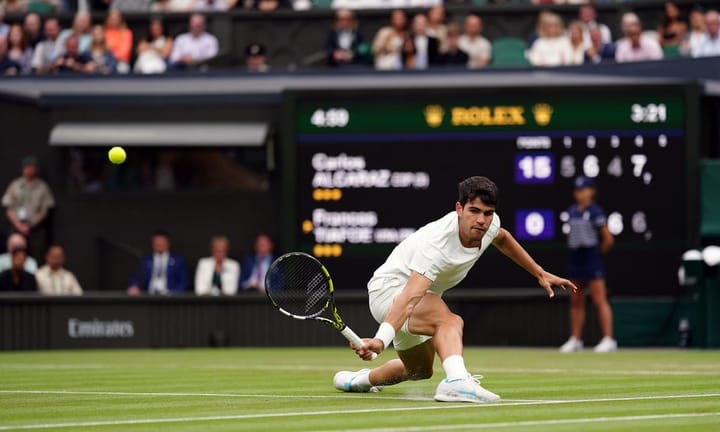 Carlos Alcaraz triumphs with nail-biting victory in intense five-set match against Frances Tiafoe.