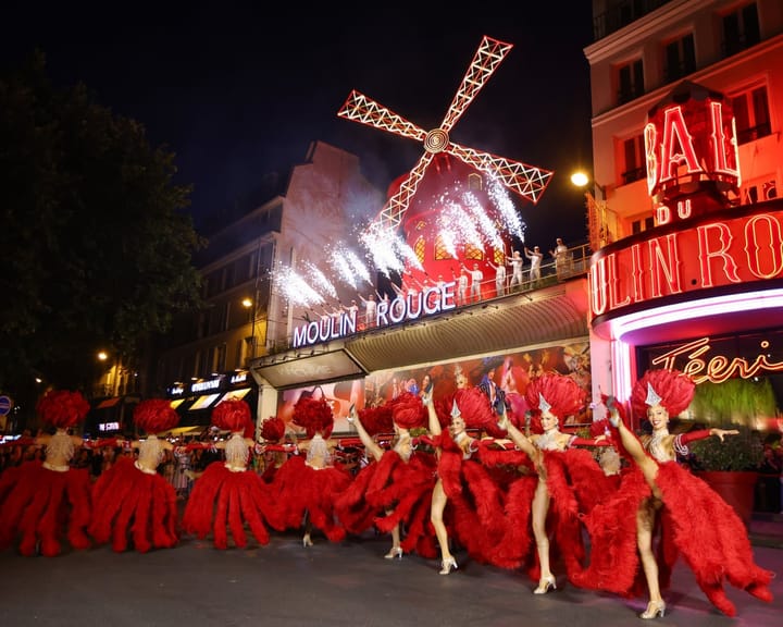 Moulin Rouge windmill spins anew, delighting Paris a year after fall