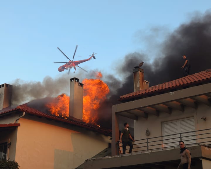 "Athens suburb evacuated as wildfire rages in northern area"
