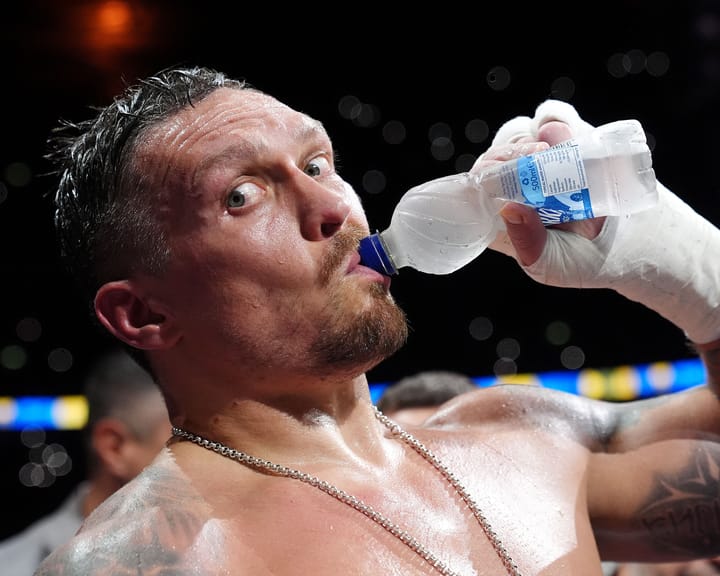 "Usyk drapes Ukraine flag over shoulders, dominates Dubois with powerful punches"