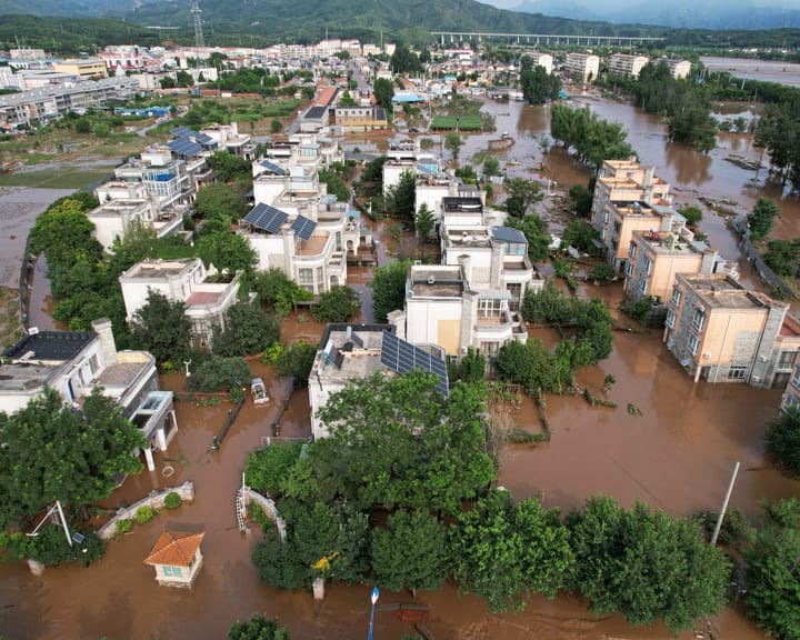 "Over 30 dead in Beijing floods as thousands flee rising waters"