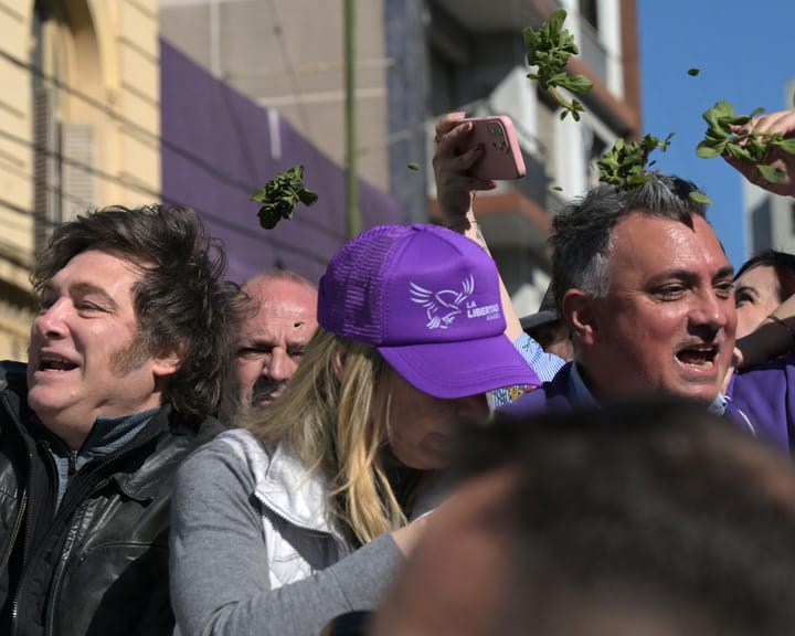 Protesters hurl rocks at Argentina’s Milei during campaign stop as sister faces corruption allegations