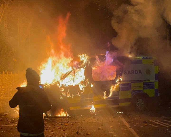 Protesters torch police vehicle outside Dublin asylum seeker hotel