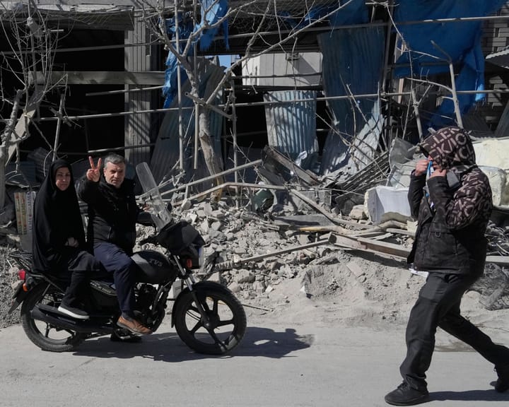 Tehran's streets echo defiance and hope amid overwhelming fear.