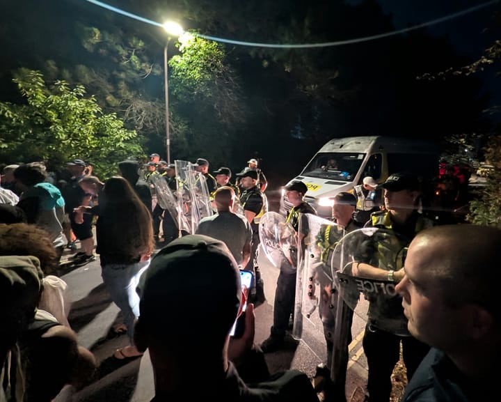 Black-clad Christian vigilantes labeled ‘army of patriots’ swarm Portsmouth